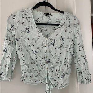 Long sleeve top with tie front bow